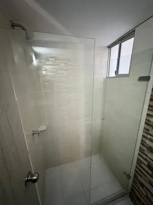 a bathroom with a shower with a glass door at Apartamento norte de Barranquilla in Barranquilla