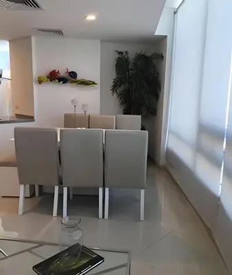 a dining room with a table and chairs at Apartamento en Bluegardens 1405 in Barranquilla