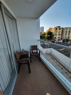 a balcony with a table and a chair on a building at Hermoso apartamento in Cartagena de Indias