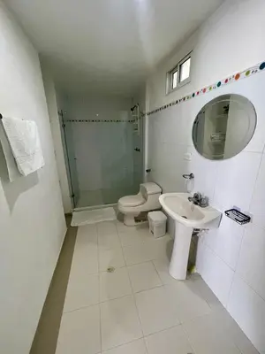 a bathroom with a toilet and a sink and a shower at Apartamentos cerca al hotel Las Americas in Cartagena de Indias
