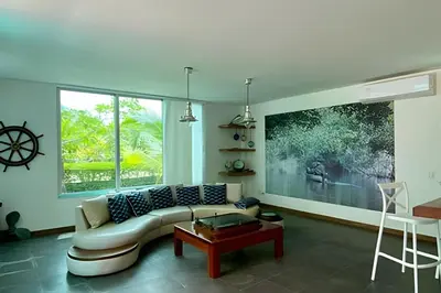 a living room with a couch and a table at Casa de playa Manglares in Tolú