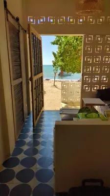 an open door with a view of the beach at Casa en el Mar in San Onofre