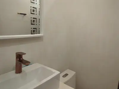 a bathroom with a sink and a toilet at Casa en el Mar in San Onofre