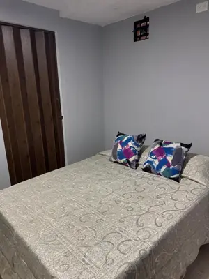 a bed with two pillows on top of it at Apartamento 2 habitaciones zona Riomar Barranquilla in Barranquilla