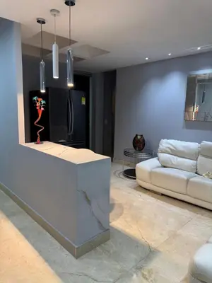 a living room with a couch and a table at Apartamento 2 habitaciones zona Riomar Barranquilla in Barranquilla