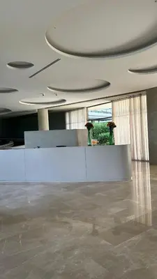 a lobby with a counter and vases in a building at Apartamento de lujo para estrenar en Morros Cartagena in Cartagena de Indias