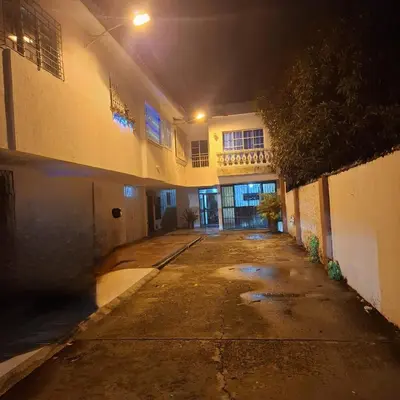 an empty hallway of a building at night at Habitación Girasoles in Cartagena de Indias