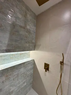 a bathroom with a shower with a glass door at Comfort Retreat in Bocagrande in Cartagena de Indias