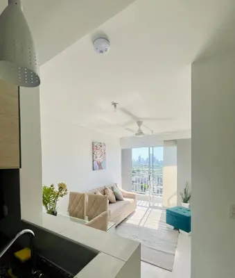 a white living room with a couch and a window at Beautiful view in Cartagena in Cartagena de Indias