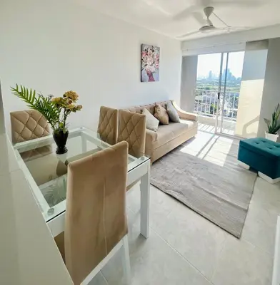 a living room with a couch and a table at Beautiful view in Cartagena in Cartagena de Indias