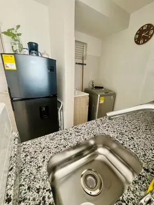 a kitchen with a stainless steel sink and a refrigerator at Beautiful view in Cartagena in Cartagena de Indias