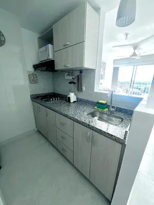 a kitchen with a sink and a counter top at Beautiful view in Cartagena in Cartagena de Indias