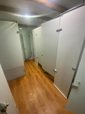 an empty closet with white doors and a wooden floor at Euphoria Beach in Playa Blanca