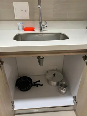 a kitchen sink with a pot and a pan under it at Casa ayola in Cartagena de Indias
