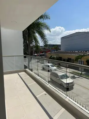 a view of a parking lot with a car on a balcony at Casa ayola in Cartagena de Indias