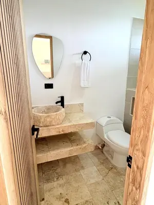 a bathroom with a sink and a toilet at Apartment in Coveñas FOREST in Coveñas