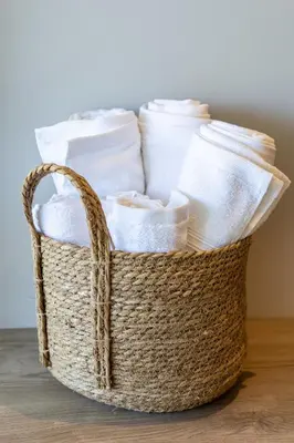 a basket filled with toilet paper on a table at Cosy seaside studio with sunset view in Cartagena de Indias