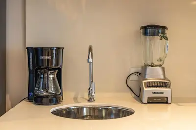 a blender sitting on a counter next to a counter top at Cosy seaside studio with sunset view in Cartagena de Indias