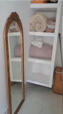 a mirror in front of a white closet with towels at Apartastudio 1 Habitacion - Manga in Cartagena de Indias