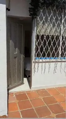 an open door to a room with a window at Apartastudio 1 Habitacion - Manga in Cartagena de Indias
