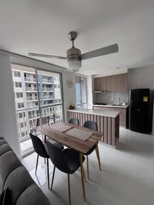 a kitchen and dining room with a table and chairs at Apartmento en Ciudad Mallorquín in Puerto Colombia