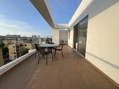 a balcony with a table and chairs on a balcony at Apartment with large balcony in Cartagena de Indias