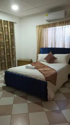 a bedroom with a large bed in a room at Prado alto inn in Barranquilla
