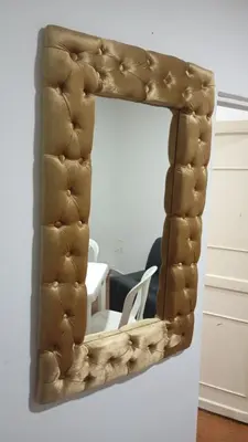 a mirror hanging on a wall in a room at Apartamento #4 in Puerto Colombia