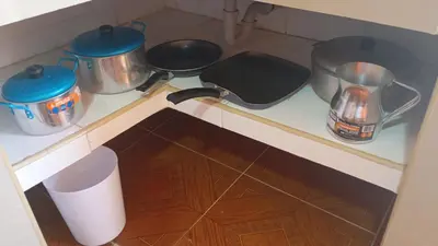 a kitchen counter with pots and pans on a stove at Apartamento #5 in Puerto Colombia