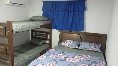 a bedroom with two bunk beds and a window at Apartamento #6 in Puerto Colombia