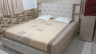 a bedroom with a bed and a dresser at Apartamento #7 in Puerto Colombia