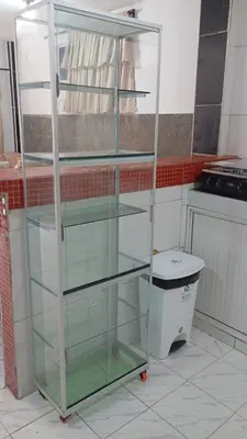 a glass shelf in a kitchen with a trash can at Apartamento #7 in Puerto Colombia