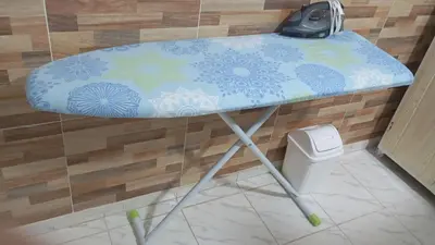 a blue table in a bathroom with a toilet at Apartamento #7 in Puerto Colombia