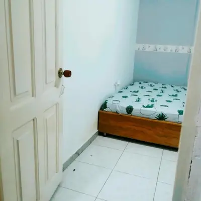 a small bedroom with a bed in a room at Rey Salomón in Barranquilla