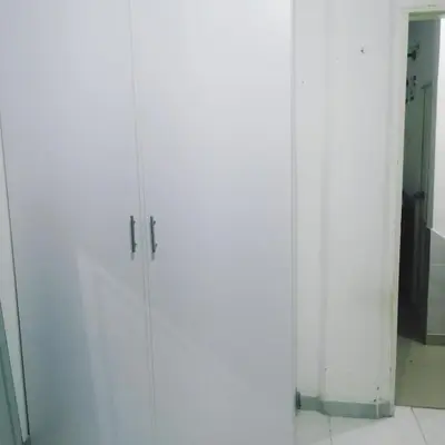 a pair of white cabinets in a room at Rey Salomón in Barranquilla