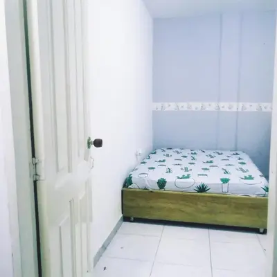 a small bedroom with a bed in a room at Rey Salomón in Barranquilla