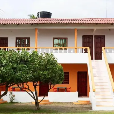 a house with a staircase leading up to it at Cabañas Capilla Del Mar in San Bernardo del Viento