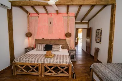 a bedroom with a large bed in a room at Casa del Mar by Al Alma in San Onofre