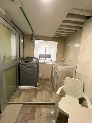 a small kitchen with a trash can and a sink at Acogedor y Moderno Apartamento en Barranquilla in Barranquilla