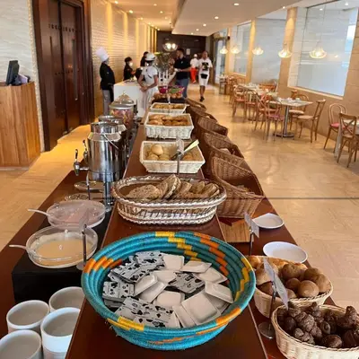 a long table with many baskets of food on it at Beachfront Apartment at Radisson Hotel in Cartagena de Indias