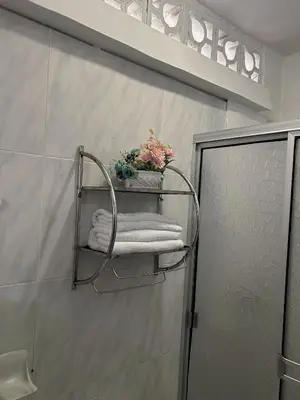 a towel rack on the wall of a bathroom at Art House Getsemaní in Cartagena de Indias