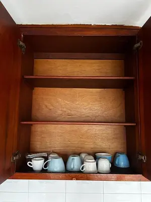a cupboard filled with blue and white vases at Art House Getsemaní in Cartagena de Indias