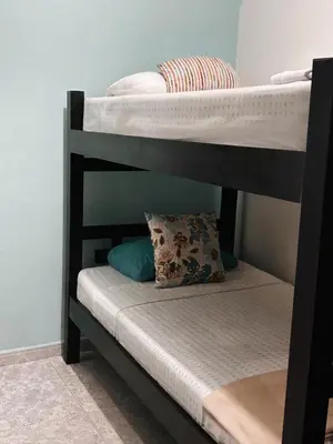 a bunk bed with a pillow on the bottom bunk at Art House Getsemaní in Cartagena de Indias