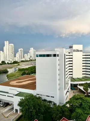 a white building with a city in the background at Apartamentos Por dias Laguito Ctg in Cartagena de Indias