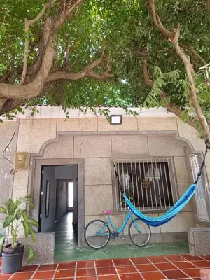 a blue bike parked in front of a building at Casa yamulemao in Cartagena de Indias