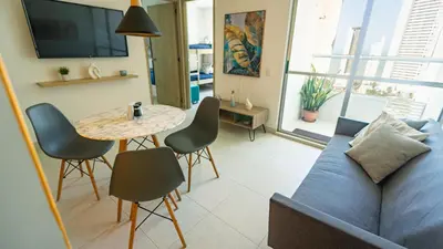 a living room with a couch and a table at Apartamento Oasis Cartagena in Cartagena de Indias