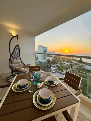a dining room table with a view of the ocean at CB1108 | Sunset Suite con Frente al Mar in Cartagena de Indias