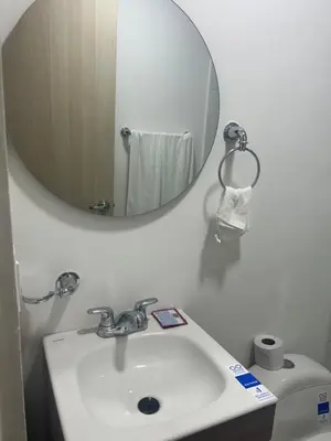 a bathroom with a sink and a mirror at Aparta suite in Cartagena de Indias
