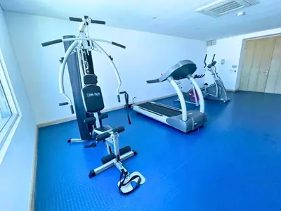a gym with two exercise bikes and a treadmill at Apto Con Ubicación Privilegiada in Barranquilla