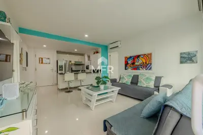 a living room with a couch and a table at Luxury beachfront Condo Edificio Morros 3 by Inmobiliaria MFR in Cartagena de Indias